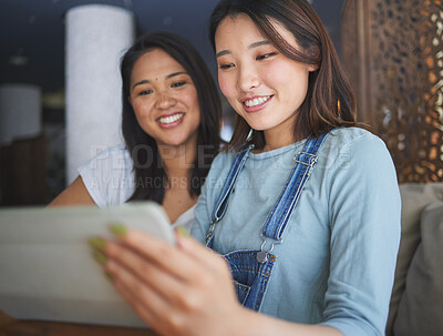 Buy stock photo Restaurant, tablet and Asian women for online menu, food options and order for lunch, meal or dinner. Coffee shop, cafe and happy friends on digital tech for social media review, website and app