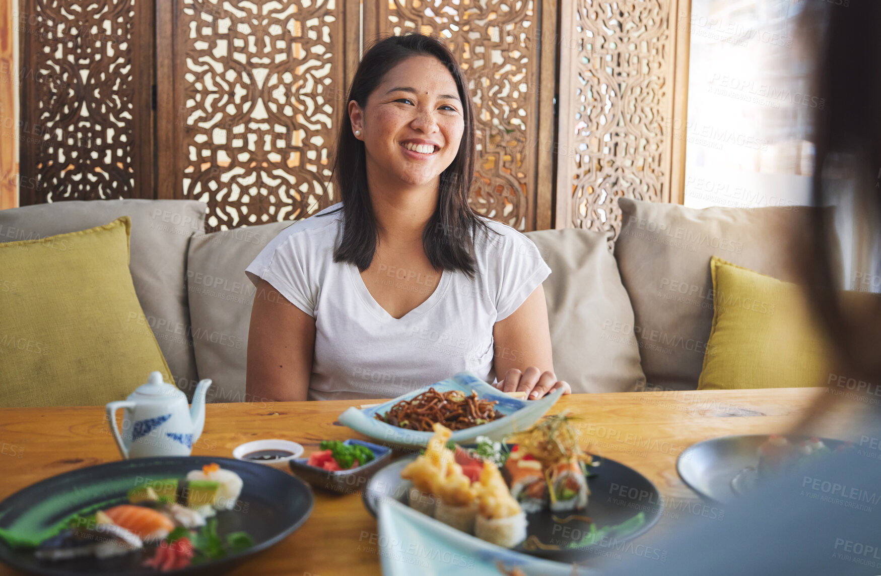 Buy stock photo Sushi, restaurant and Japanese food with a woman smile with noodles and fish dish. Lunch, hungry Asian female person and Chinese meal with a friend happy from bonding and eating together at a table 