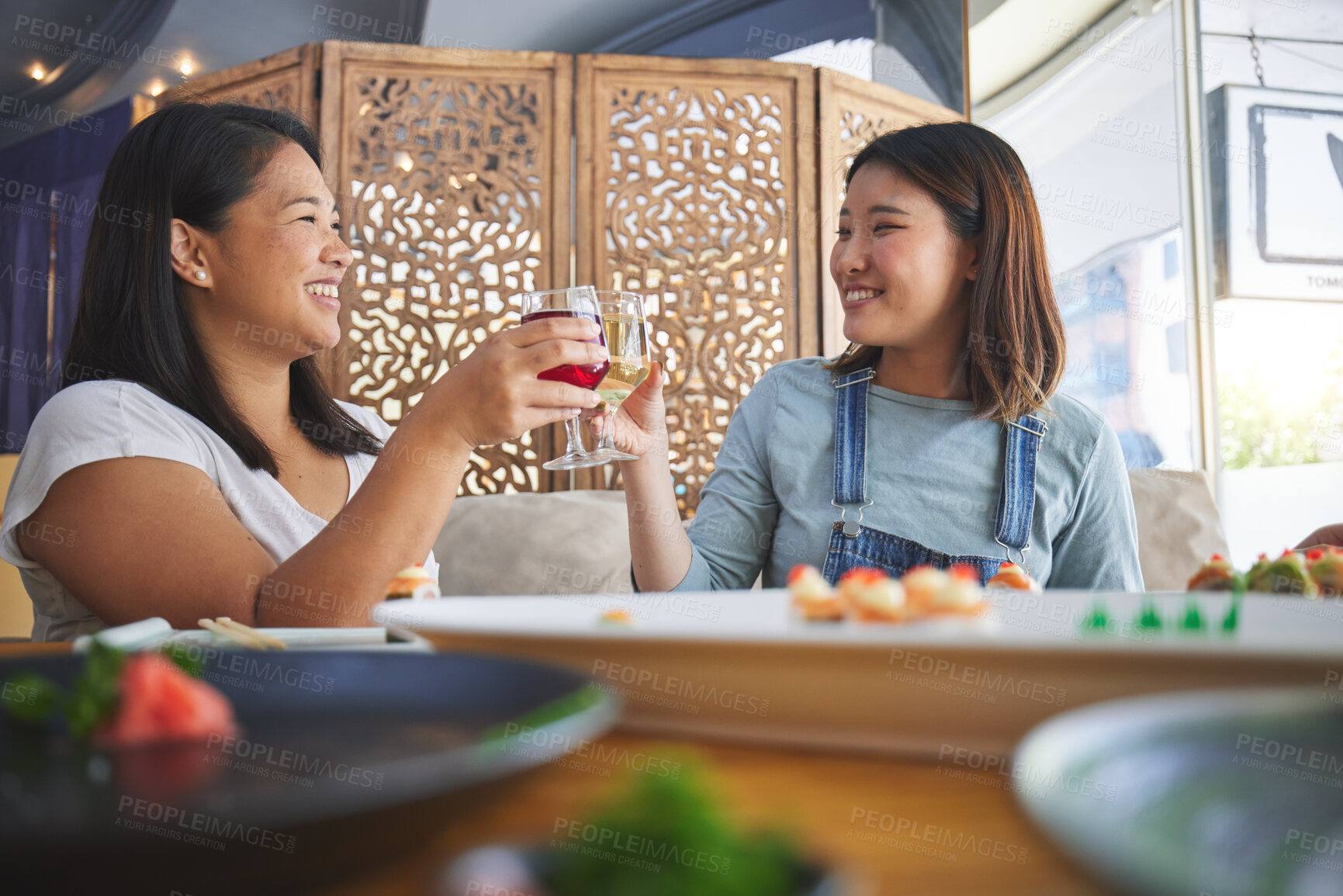 Buy stock photo Japanese women, restaurant and toast with sushi, smile and congratulations with fine dining, party or thinking. Asian friends, happy and success with fish, alcohol or relax in diner, wine and thanks