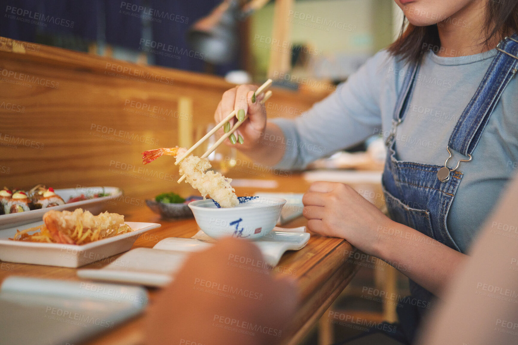 Buy stock photo Hands, chopsticks and woman with shrimp in restaurant, fine dining and eating in cafe store. Sushi, sticks and person on prawn, tempura food and fish meat in bowl for lunch, brunch and seafood meal