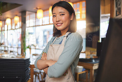 Buy stock photo Waitress, portrait and Asian woman with arms crossed at cafe, coffee shop or store. Face, smile and confident barista, happy employee or small business entrepreneur at restaurant startup in Japan