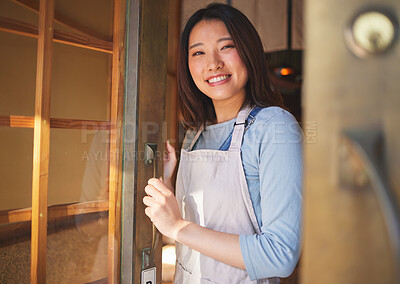 Buy stock photo Portrait, waitress and Asian woman at door of restaurant, coffee shop or retail store. Face, smile or confident barista, happy employee or small business entrepreneur welcome to cafe startup in Japan