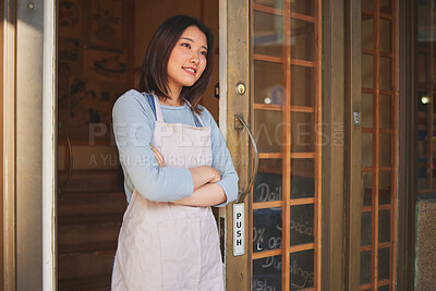 Buy stock photo Happy asian woman, thinking and restaurant by door of small business professional with arms crossed at cafe. Female person, entrepreneur or manager in welcome, food service or hospitality in store