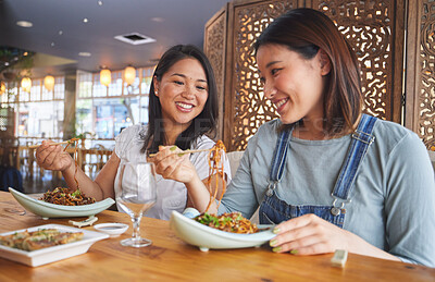 Buy stock photo Restaurant, girl friends and talking with food, noodles and cafe happy from bonding. Asian women, eating and plate together with friendship smile at a table hungry with chopsticks at Japanese bar