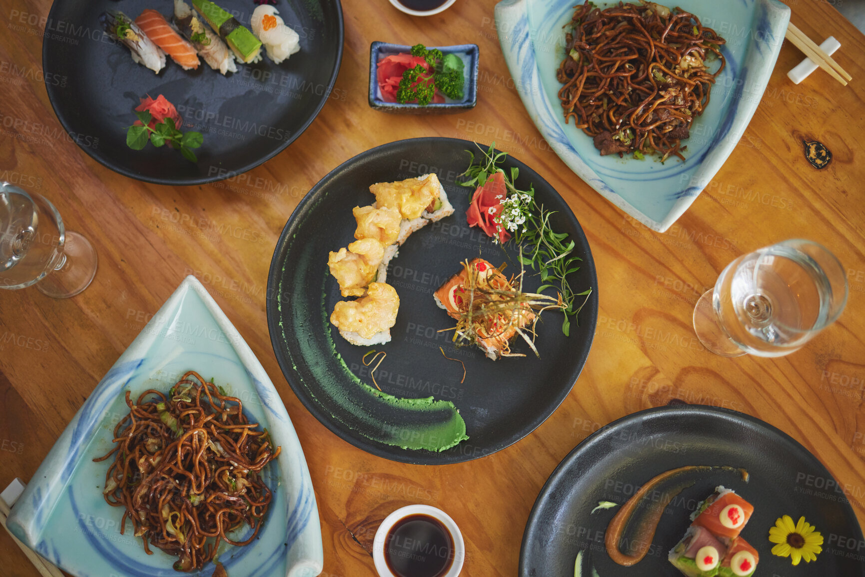 Buy stock photo Sushi restaurant, catering and plate in top view for service, lunch or dinner with noodles, chopsticks or fish. Japanese cuisine, table and food in diner, cafe or luxury for health, nutrition or diet