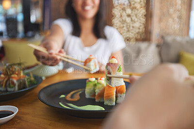 Buy stock photo Hands, chopsticks and sushi restaurant with friends, smile and excited for fine dining, party and share. Happy women, fish and healthy with culture, traditional or fast food in diner, bar or shop