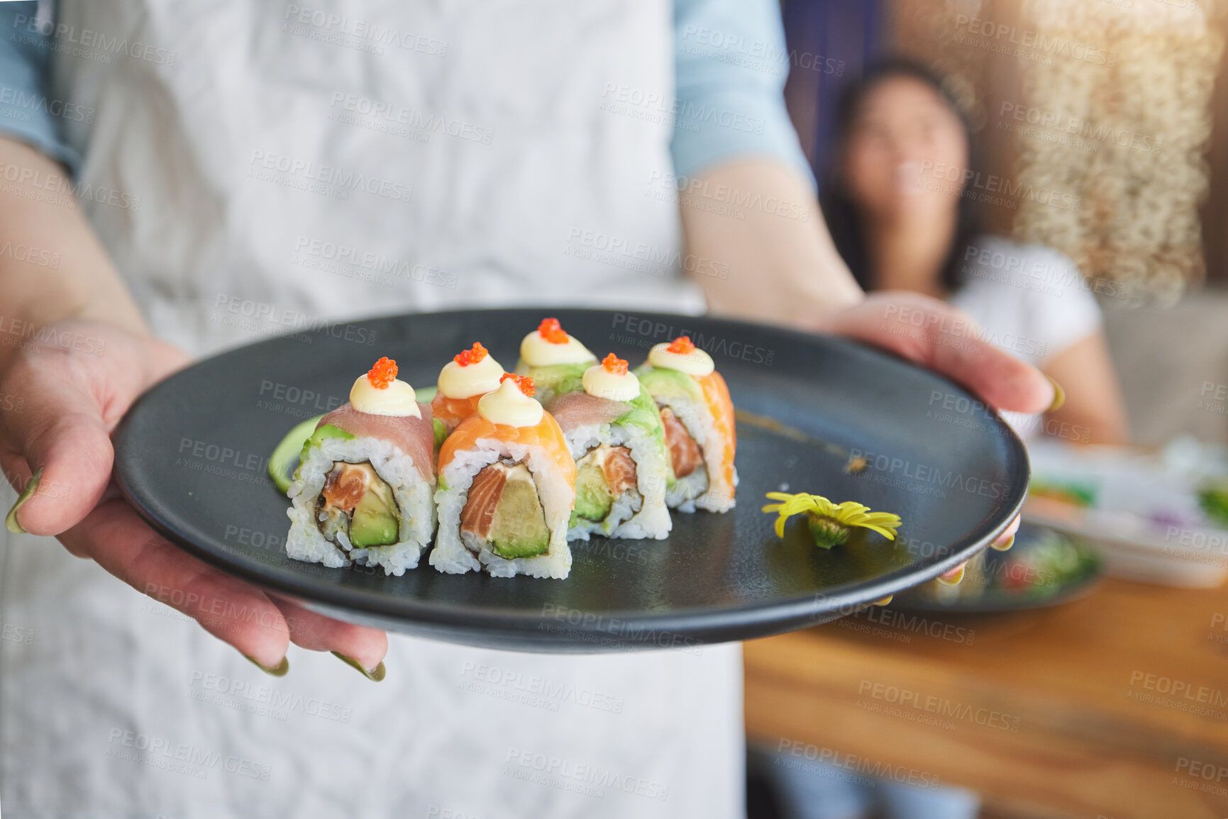 Buy stock photo Restaurant, hands and closeup of sushi on a plate for luxury, healthy and authentic Asian cuisine. Platter, fine dining and zoom of a Japanese meal for lunch, dinner or supper at a traditional cafe.