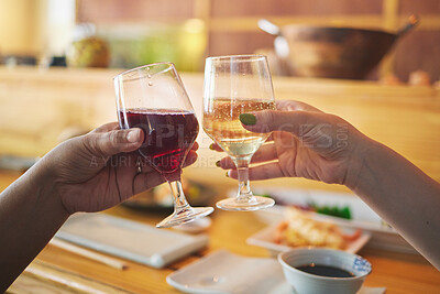 Hands, wine glass and friends toast in restaurant in celebration together. Alcohol, cheers and people drink champagne in cafe store at party, bonding or fine dining at luxury event with food on table