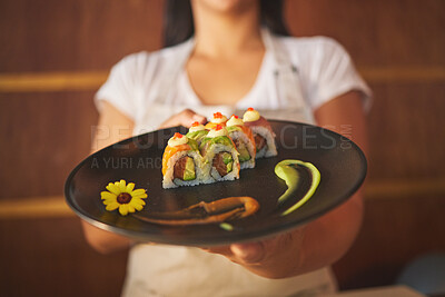 Buy stock photo Sushi plate, waiter hands and restaurant with service, helping and catering job in closeup. Small business, fast food server and cooking in cafe, startup diner and working with fish, rice or seaweed