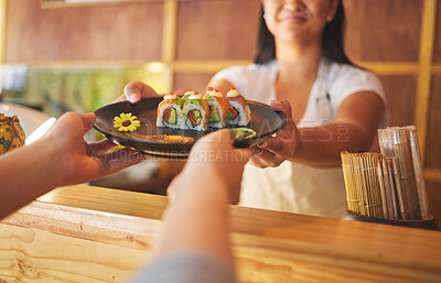 Buy stock photo Sushi, restaurant worker and woman hands with smile from food and Asian meal in kitchen. Happy, female waiter or chef working with salmon roll lunch order with cooking in Japanese bar with service