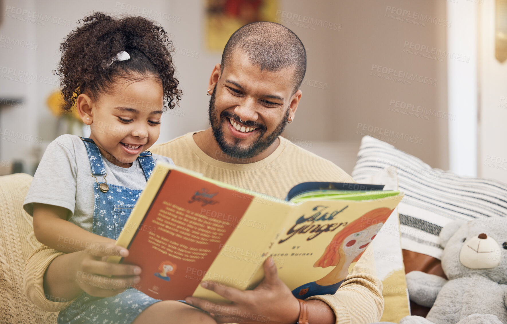 Buy stock photo Dad, girl and book on sofa with bonding, smile and love in storytelling in living room together. Happiness, father and daughter reading story on couch for fantasy, learning and education in home fun.