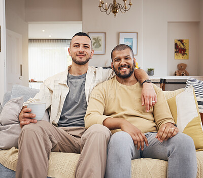 Buy stock photo Happy, smile and portrait of a gay couple on a sofa relaxing with a cup of coffee in the living room. Love, bonding and young lgbtq men with a latte sitting together in the lounge at their home.