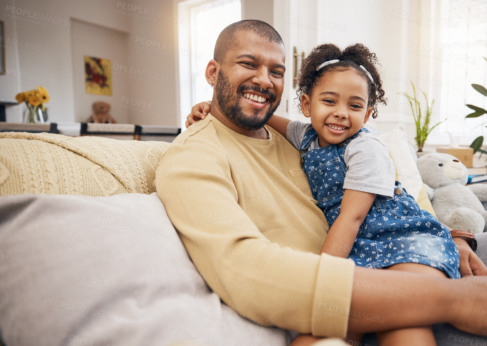 Buy stock photo Smile, portrait and girl with her father on a sofa in the living room relaxing and bonding together. Happy, love and child sitting with her young dad from Mexico in lounge of their modern family home