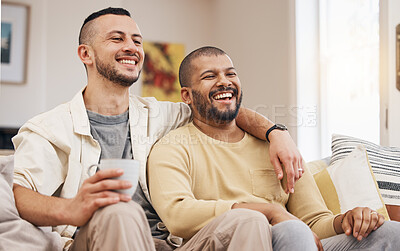 Buy stock photo Happy, laugh and gay couple watching a movie on a sofa while relaxing with a cup of coffee. Love, bonding and young lgbtq men with a latte streaming a film, show or video online in the living room.