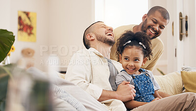 Buy stock photo Gay family, laughing and a child on a home sofa with love, care and funny joke in lounge. Lgbtq men, adoption and parents with foster girl kid together on a couch for happiness, bonding and to relax