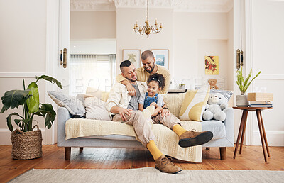 Buy stock photo Gay, happy family and a child on a sofa at home with love, care and safety in a lounge. Lgbtq men, adoption and parents with a foster girl kid together on a couch for happiness, bonding and to relax