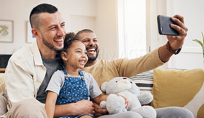 Buy stock photo Gay family, selfie and child on home sofa for video call, social media and internet. Lgbt men or parents with kid together on a couch for streaming, profile picture and adoption memory with happiness