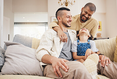 Buy stock photo Gay family, child and happy on a home sofa with love, care and safety in a lounge. Lgbtq men, adoption and interracial parents with a girl kid together on a couch for happiness, bonding and relax