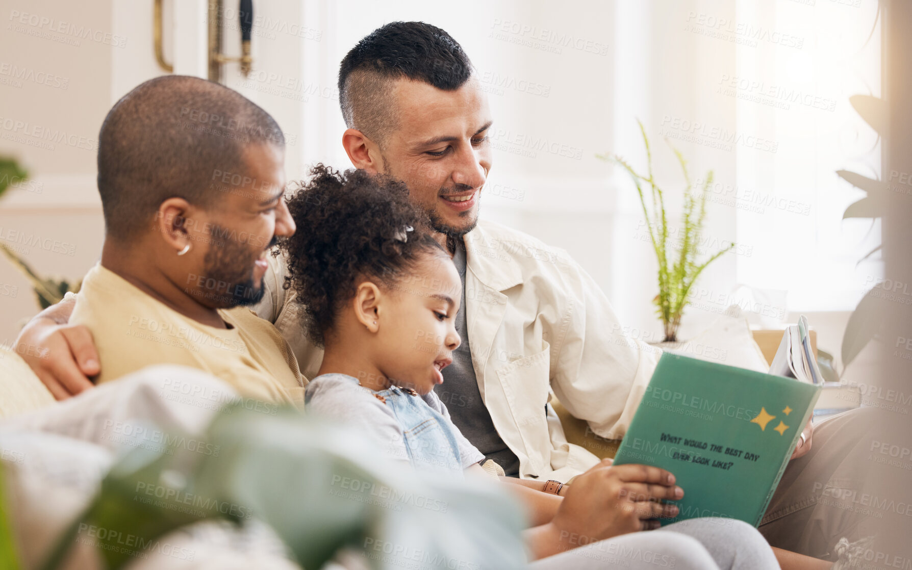 Buy stock photo Gay couple, child and book on sofa with smile, bonding and love in storytelling in living room together. Happiness, lgbt men and girl reading story on couch in fantasy, learning and education in home