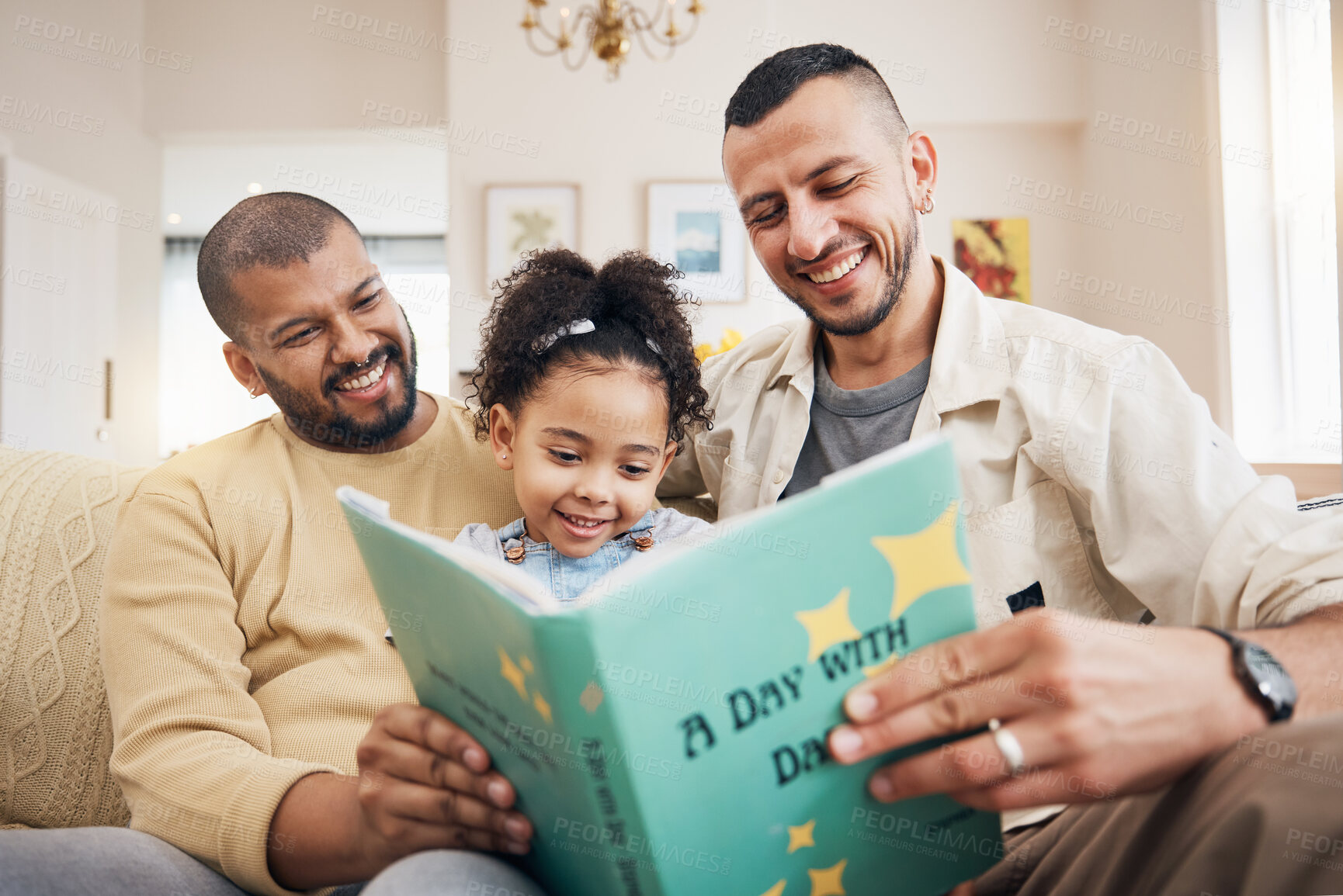 Buy stock photo Gay couple, kid and book on couch with smile, bonding and love in storytelling in living room together. Happiness, lgbt men and girl reading story on sofa for fantasy, learning and education in home.