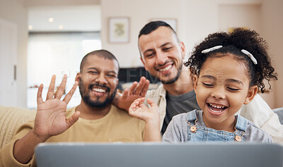 Buy stock photo Gay family, waving and video call on laptop on home sofa with a child for communication and internet. Adoption, lgbt men or parents with a kid and technology for streaming, connection and happiness