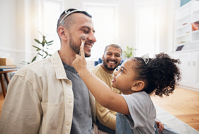 Buy stock photo Blended family, gay parents and makeup with a girl in the living room of her home for princess fantasy. LGBT, love or adoption and a daughter together with her father on the sofa for bonding closeup