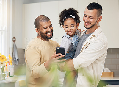 Buy stock photo Selfie, blended family and a girl with her gay parents in the kitchen together for a social media profile picture. Adoption photograph, smile or love and a daughter with her lgbt father in the home