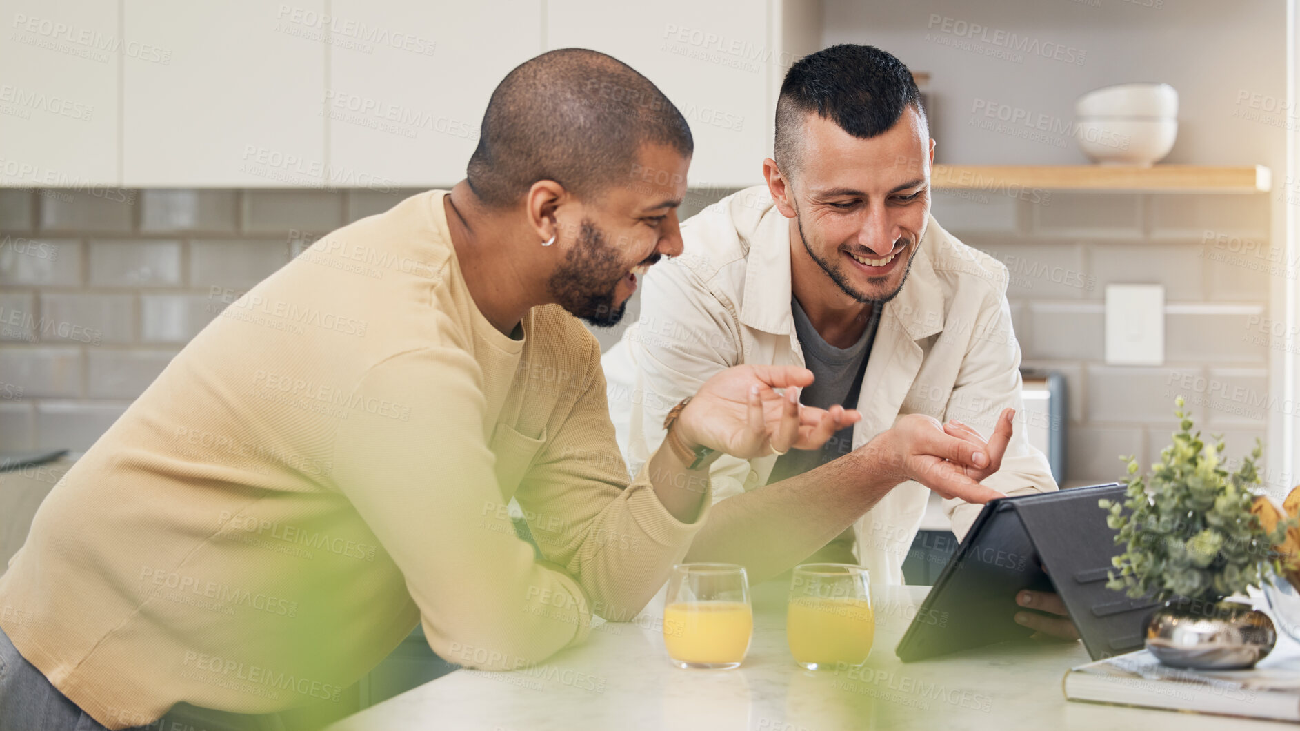 Buy stock photo Smile, streaming and a gay couple with a tablet in a kitchen for a funny video or social media. Happy, house and lgbt men with technology for communication or reading an online chat together