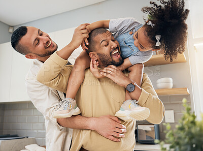 Buy stock photo Gay, happy family and playing with child in home or parents together with love, support and girl on shoulders of dad. LGBT, fathers and men with happiness, smile and fun bonding in kitchen with kid