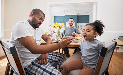 Buy stock photo Gay couple, breakfast and father feeding child meal, food or morning cereal for youth development in home dining room. Family bond, adoption or homosexual dad smile for hungry kid girl eating