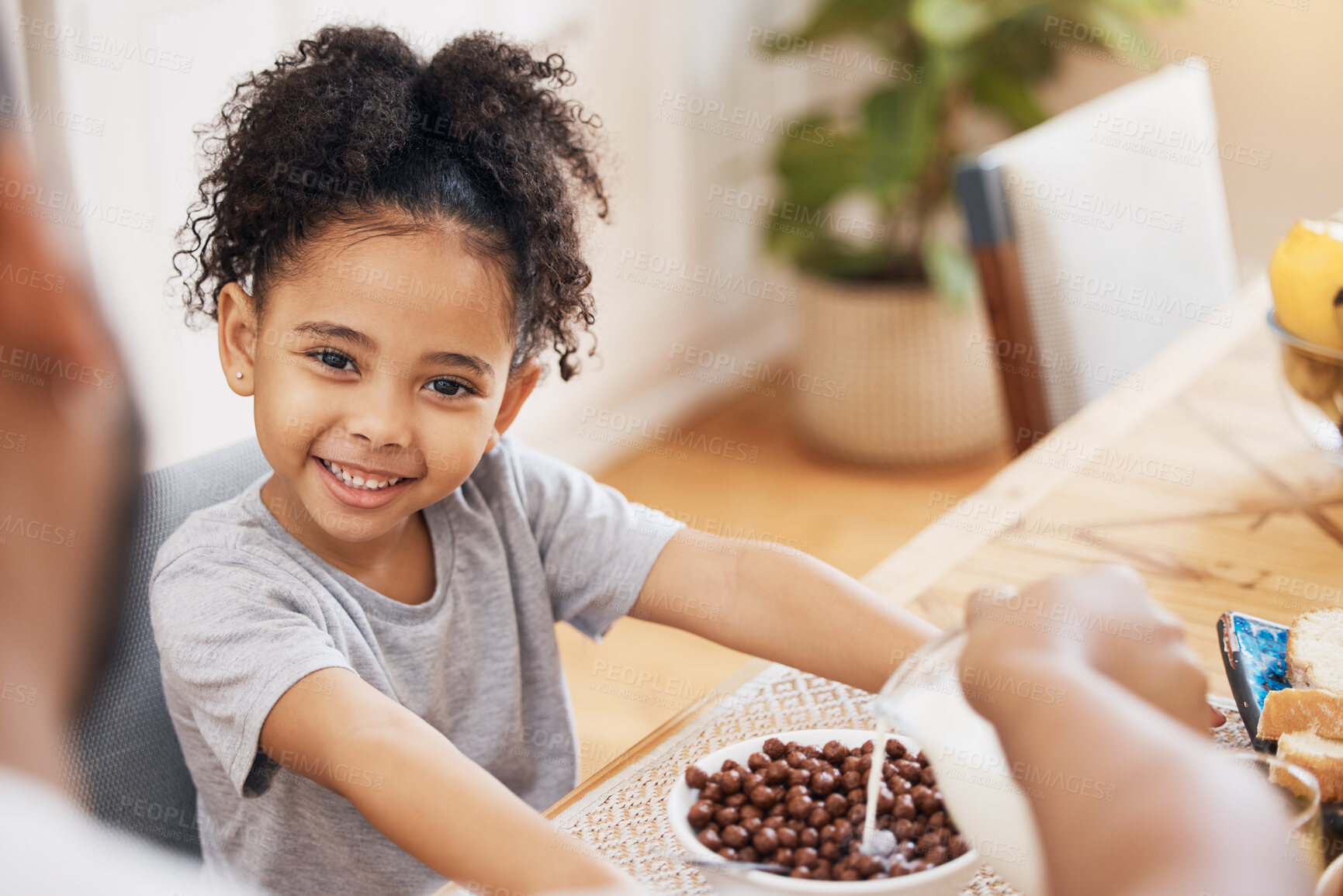 Buy stock photo Portrait, breakfast cereal and happy family kid smile for morning food, wellness and parent pour milk liquid. Home dining room, happiness and young child, youth girl and hungry for meal