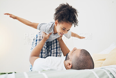 Buy stock photo Happy, fun and father with girl on bed playing, bonding and airplane game for dad with child in home. Family, love and playful energy, man holding daughter in air and laughing in bedroom together.