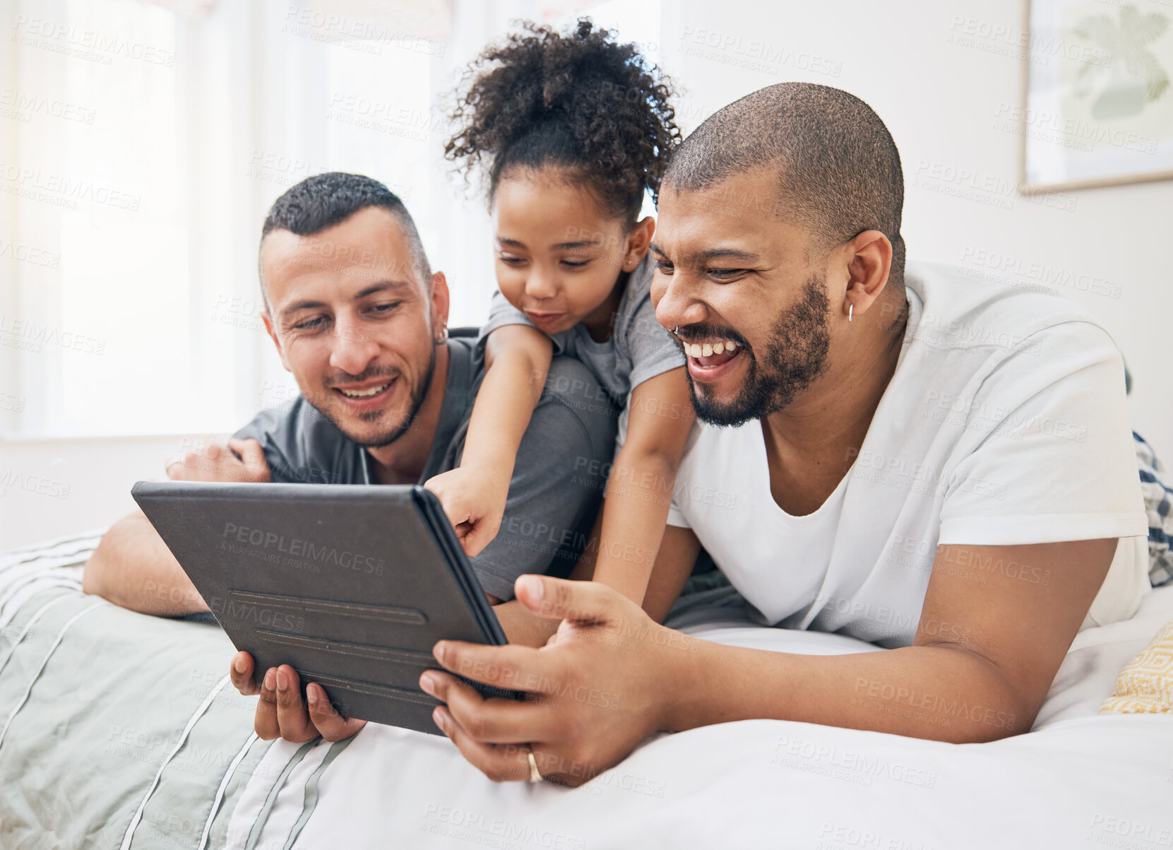 Buy stock photo Gay family, tablet and child on a bed at home for e learning, watch video and education on internet. Adoption, lgbt men or parents with a happy kid and technology for streaming movies, games or app