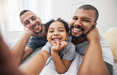 Buy stock photo Gay, family and selfie portrait of child in home bedroom, bonding and fun together. Face of men, lgbtq parents and girl on bed in adoption, foster and profile picture, happy memory and interracial