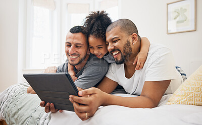 Buy stock photo Child, gay family and tablet on bed at home for e learning, watch video and education on internet. Adoption, lgbt men or parents with happy kid and technology for streaming movies, games or funny app