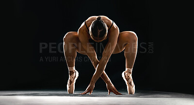 Buy stock photo Art, ballet and flexible woman on black background in dance performance with balance, stretching and talent. Dark aesthetic, ballerina or dancer training with fitness, creativity and studio exercise.