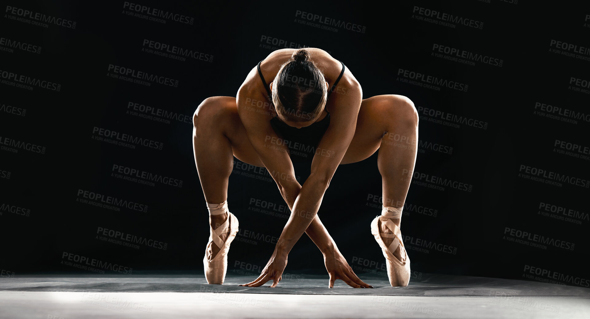 Buy stock photo Art, ballet and flexible woman on black background in dance performance with balance, stretching and talent. Dark aesthetic, ballerina or dancer training with fitness, creativity and studio exercise.