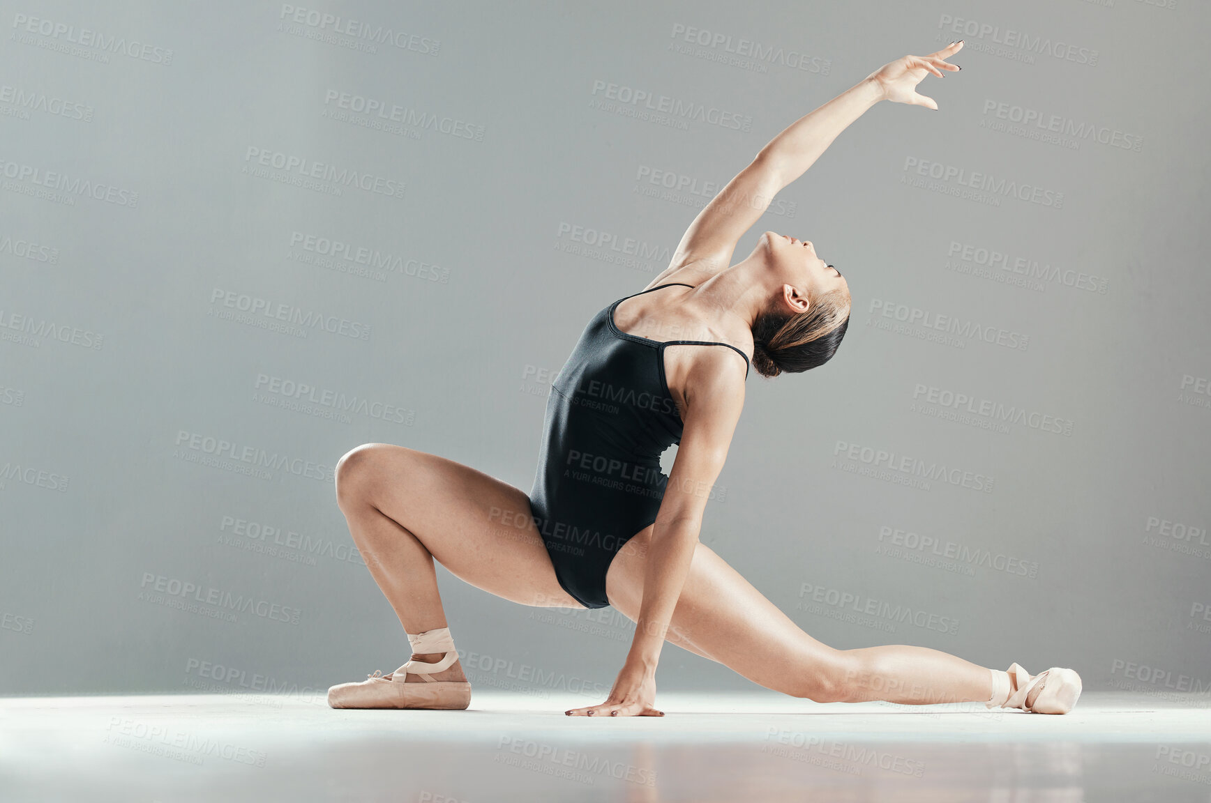 Buy stock photo Dance, ballet and woman stretching in art performance in studio isolated on gray background mockup space. Ballerina, theatre or creative person training, workout or exercise, healthy body or flexible