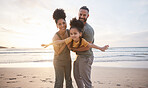 Family, portrait and beach for airplane, travel and freedom, bond and fun in nature together. Love, flying and happy girl child with parents at the ocean playing, relax and smile on summer holiday
