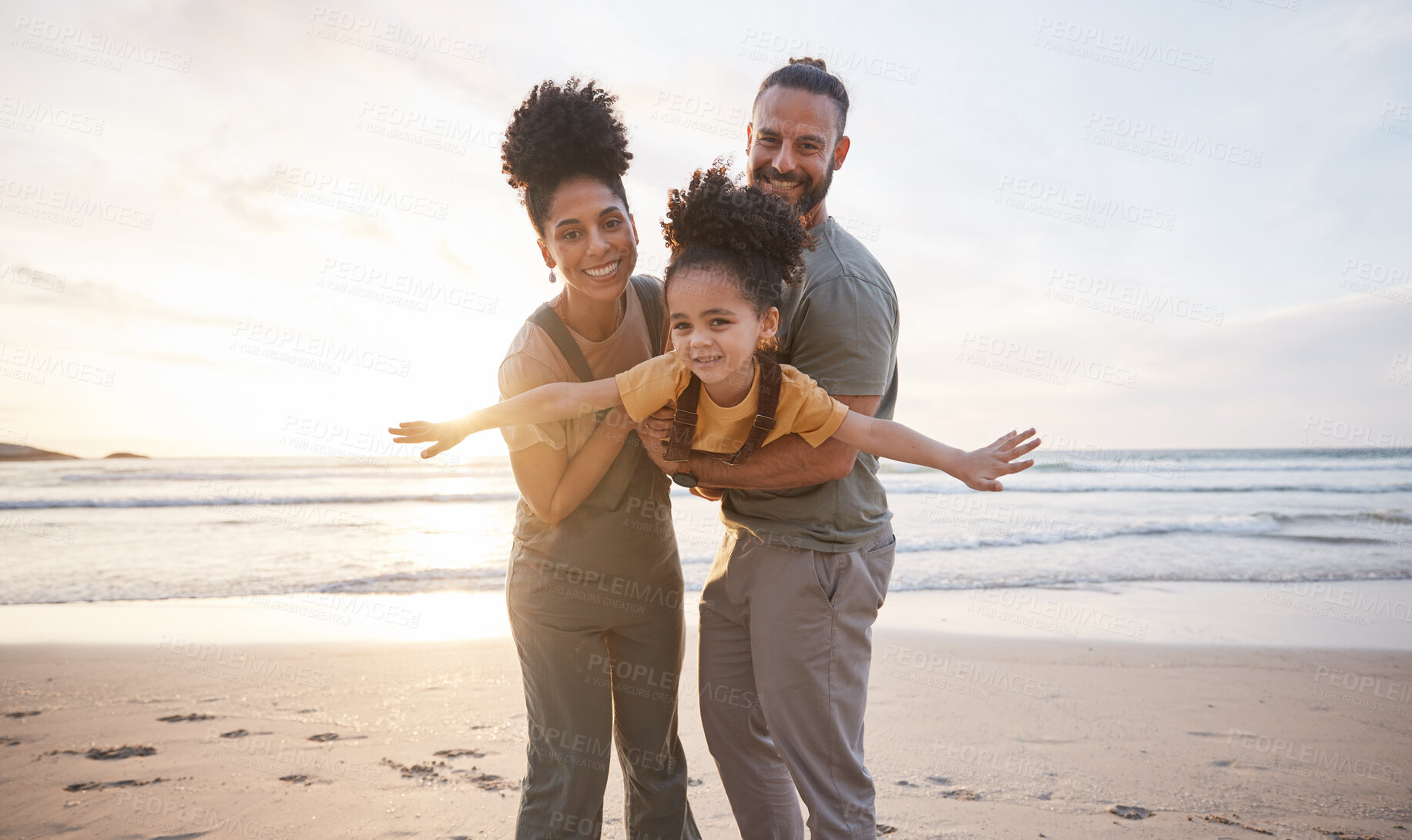 Buy stock photo Family, portrait and beach for airplane, travel and freedom, bond and fun in nature together. Love, flying and happy girl child with parents at the ocean playing, relax and smile on summer holiday
