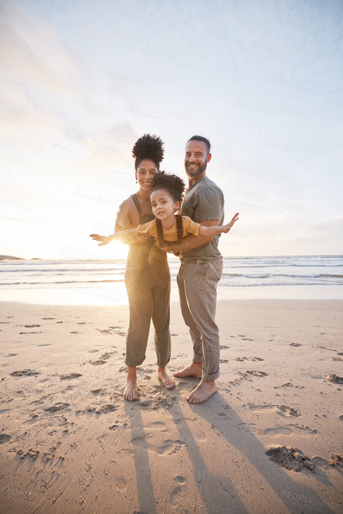 Buy stock photo Parents, girl child and beach with airplane game, smile or portrait for bonding, love or sunset on holiday. Father, mother and daughter for plane, play or interracial family on vacation, waves or sea