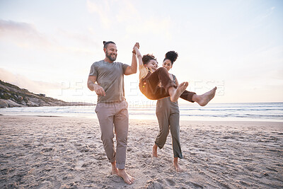 Buy stock photo Happy, swing and holding hands with family at beach for bonding, summer vacation and travel. Smile, sunset and relax with parents and child walking on seaside holiday for love, freedom and support