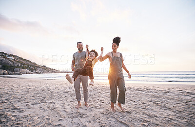 Buy stock photo Travel, swing and holding hands with family at beach for bonding, summer vacation and happy. Smile, sunset and relax with parents and child walking on seaside holiday for love, freedom and support