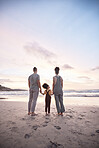 Back view, family at beach and holding hands at sunset, bonding or fun outdoor on mockup space. Rear, sea and father, kid and mother at ocean in interracial care, summer holiday or vacation to travel