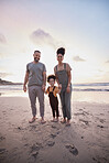 Portrait, sunset and family holding hands, beach and bonding with vacation, travel and ocean getaway. Happy parents, mother or father with girl, child or sand with seaside holiday, adventure and love