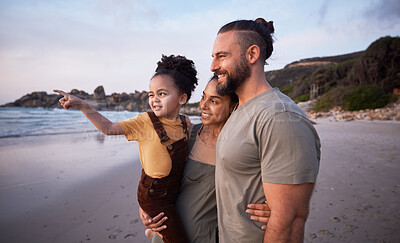 Buy stock photo Child, pointing and happy family on beach at sunset on summer, vacation or bonding together on tropical holiday in Costa Rica. Ocean, view and interracial parents support girl or kid show with hand