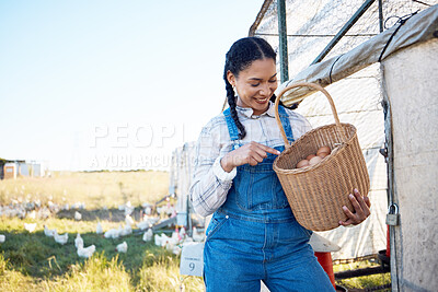Buy stock photo Woman with eggs in basket on farm chicken on grass, smile and sunshine in countryside field for sustainable business. Agriculture, poultry farming and happy farmer holding food in nature with animals