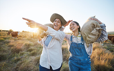 Buy stock photo Hand pointing, happy and women on a farm for sustainability, agro and cattle farming together. Farmer, team female friends in a field for agriculture, eco friendly and livestock, cow or animal check
