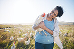 Farm, agriculture and a woman outdoor with a chicken for animal care, development and small business. Farming, sustainability and farmer person with organic or free range produce in countryside