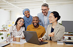 Business people, computer and teamwork or planning for marketing, website design and presentation in office. Group of men and woman on laptop for online news, startup meeting or project collaboration